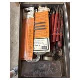 Metal box containing woodcarver tools, jigsaw