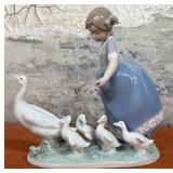 303 - PORCELAIN GIRL WITH DUCK FIGURINE