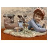 303 - PORCELAIN LLADRO BOY WITH DOG FIGURINE