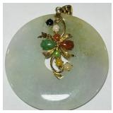 A LARGE 14KT GOLD JADE PENDANT
