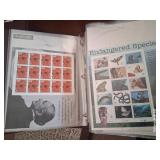 J - LOT OF COLLECTIBLE POSTAGE STAMPS IN BINDER
