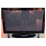 K - SAMSUNG FLAT SCREEN TELEVISION w/ REMOTE 42"