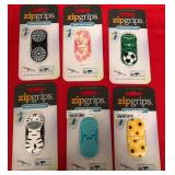 43 - ASSORTED ZIPGRIPS PHONE STANDS
