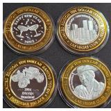 LOT OF 4 - $10  SILVER DOLLAR GAMING TOKEN (551 B)