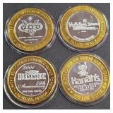LOT OF 4 - $10  SILVER DOLLAR GAMING TOKEN (551 E)