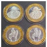 LOT OF 4 - $10  SILVER DOLLAR GAMING TOKEN (551 O)