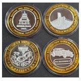 LOT OF 4 - $10  SILVER DOLLAR GAMING TOKEN (551 D)