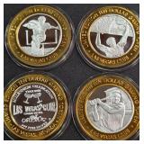 LOT OF 4 - $10  SILVER DOLLAR GAMING TOKEN (551 R)