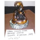SMALL SIGNED OTTER BRONZE STATUE