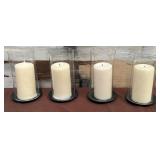 486 - FOUR GLASS CANDLE HOLDERS WITH CANDLES