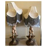 R - TWO FIGURAL TABLE LAMPS WITH FRINGED SHADES
