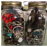 W - TWO GLASS JARS WITH COSTUME JEWELRY (L86)