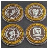 LOT OF 4 - $10  SILVER DOLLAR GAMING TOKEN (551 Z)