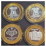 LOT OF 4 - $10  SILVER DOLLAR GAMING TOKEN (551 I)
