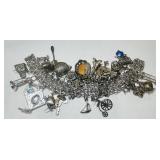STERLING SILVER  CHARM BRACELT 119 GRS 33 CHARMS
