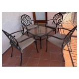 20 - GLASS TOP PATIO TABLE WITH FOUR CHAIRS