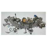 STERLING SILVER  CHARM BRACELT 119 GRS 33 CHARMS