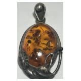 A ALRGE STERLING SILVER AMBER PENDANT