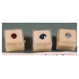 700 - THREE LOOSE GEMSTONES