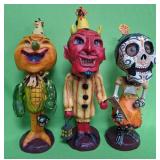 548 - THREE DECORATIVE FOLK-ART STYLE FIGURINES