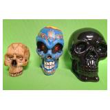 548 - THREE DECORATIVE SKULLS (A22)
