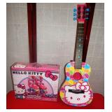 289 - ADORABLE HELLO KITTY SKATES & GUITAR
