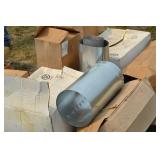 assorted unused furnace ducting materials.