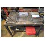 Table with wired racks and cases