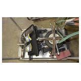 Cart with booster cables, tire wrenches, mudflaps