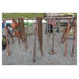 Metal bar with assorted chains and cables