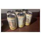 Six cans, lone tree, apple ginger