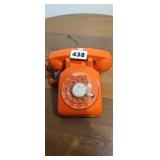Vintage orange rotary phone