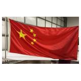 Chinese flag and stand contents behind the stand