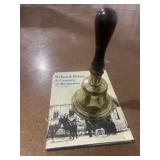 Vintage school bell and book