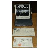 Vintage check writer and two checks
