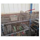 Top shelf of fryer baskets