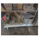 Bottom shelf of fryer baskets
