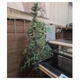 Artificial Christmas tree approximately 7 ft tall