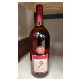 1.5L bottle of Barefoot White Zinfandel wine.