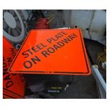 Steel plate on roadway metal sign