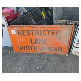 2 restricted lane with a head signs