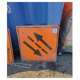 Three metal two-way traffic signs