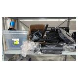 A full shelf of vacuum cleaner parts and vacuum