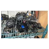 A pile of power adapters different types