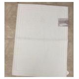 $13 Cotton woven bath mat - used/stain