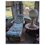 Wooden chaise lounge, wooden table and vintage tulip light