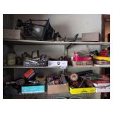 3 shelves: outdoor lamp, weed eater line, impact wrench, spark plugs, distributor cap and misc.