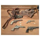 4 Vintage cap pistols w belts and holsters