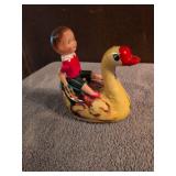 Vintage Wind-up with celluloid child riding tin goose