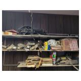 4 shelves: wheel hubs, Auto manuals, shop fluids, car parts and misc.